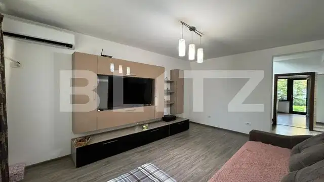 Casă în regim P+E+M, 130 mp², curte privată, zona Romanești