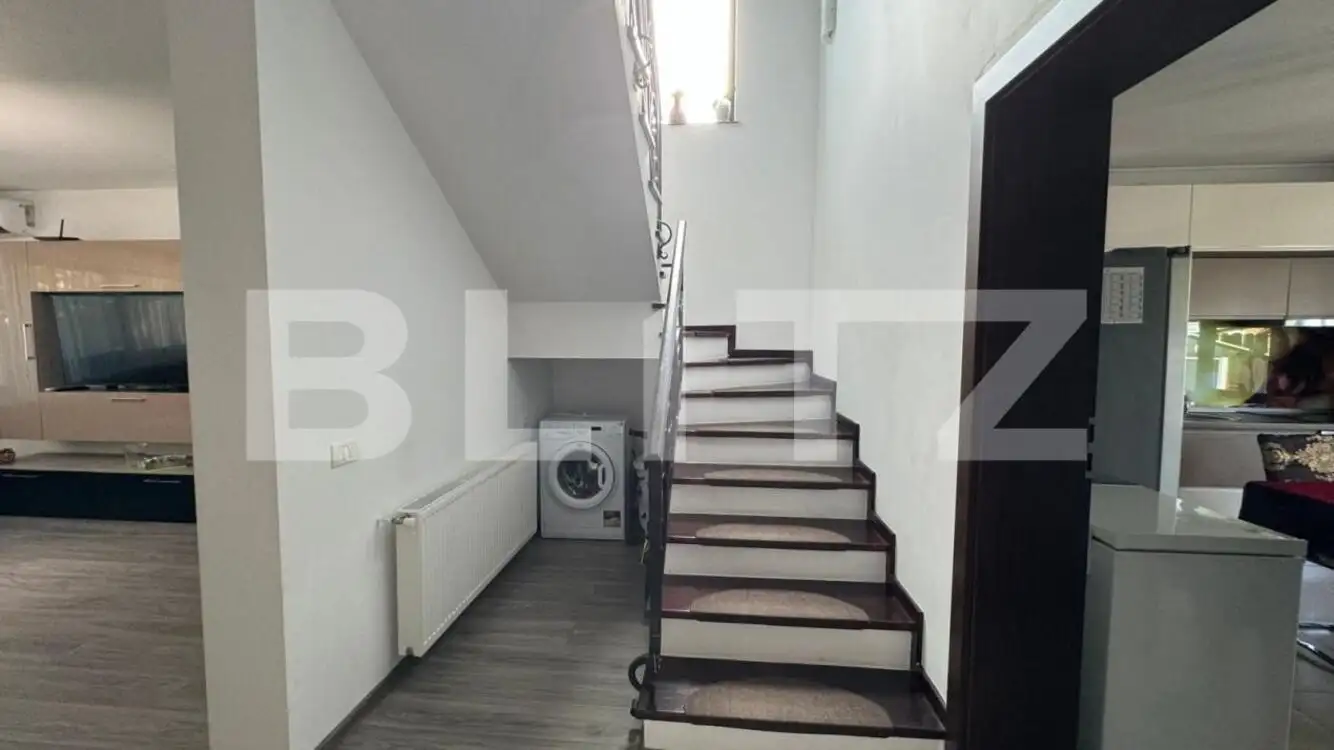 Casă în regim P+E+M, 130 mp², curte privată, zona Romanești